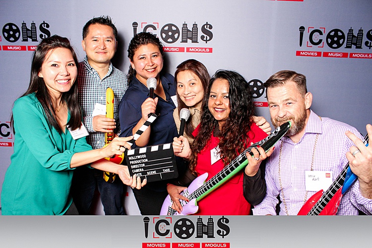 Group of people smiling and posing for a photo