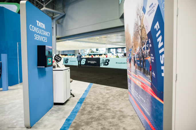 blue expo booth and a white stand