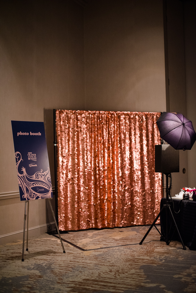 Photo backdrop and a sign next to a photo stand