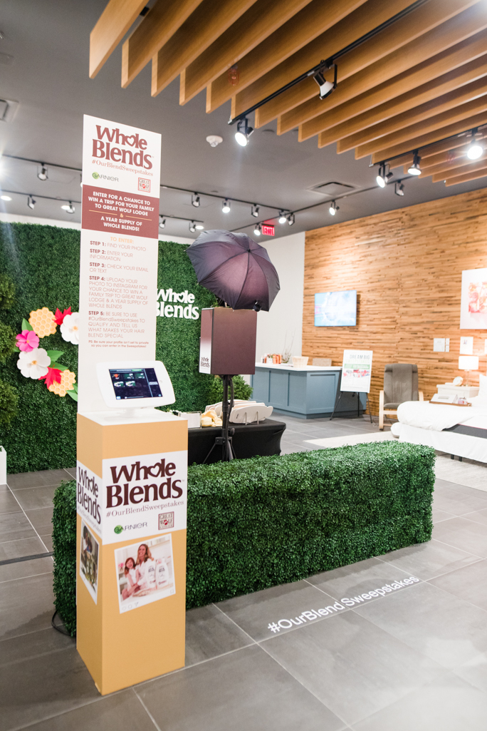 sharing station and green backdrop in a store