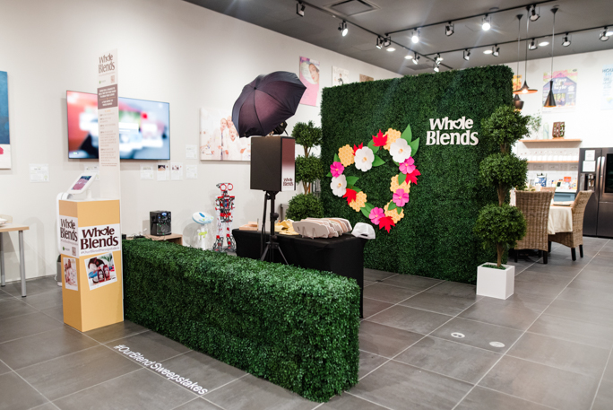 Green backdrop with flowers and kiosk 