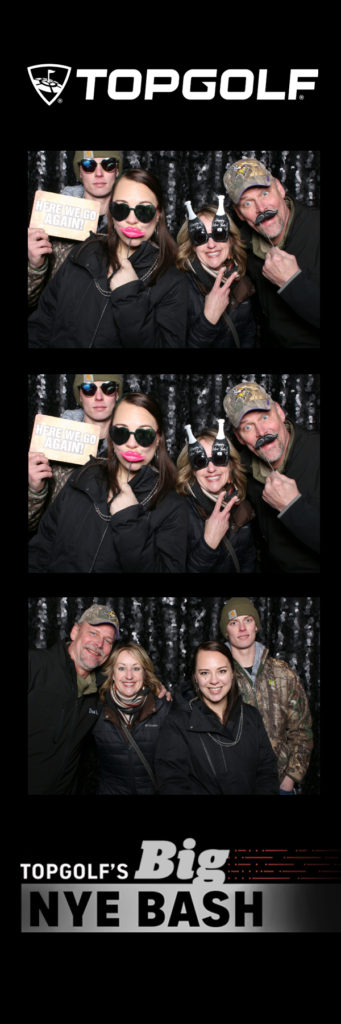 Photo strip with 4 people posing in glasses and holding signs 