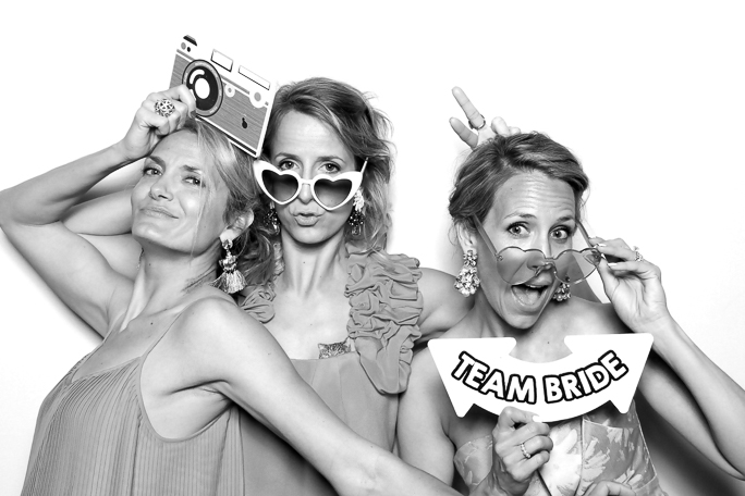 A black and white photo of three woman