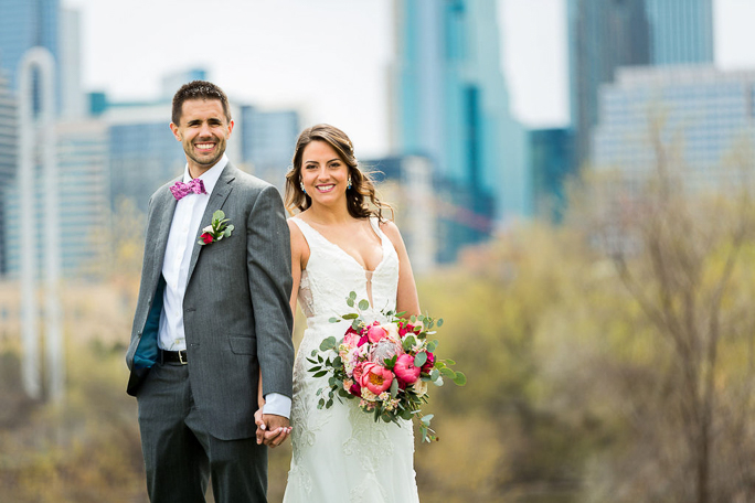 A bride and groom smiling 