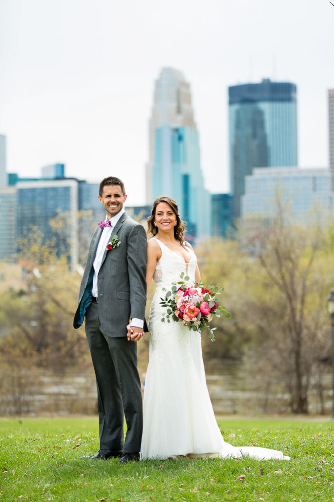 A bride and groom smiling 