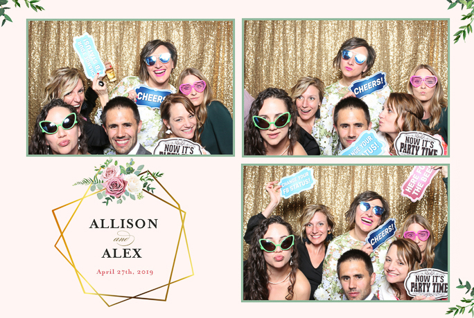 A group of people posing for photos next to a gold backdrop 