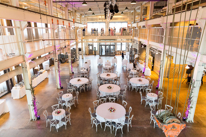 Interior of a building with tables with white table cloths 