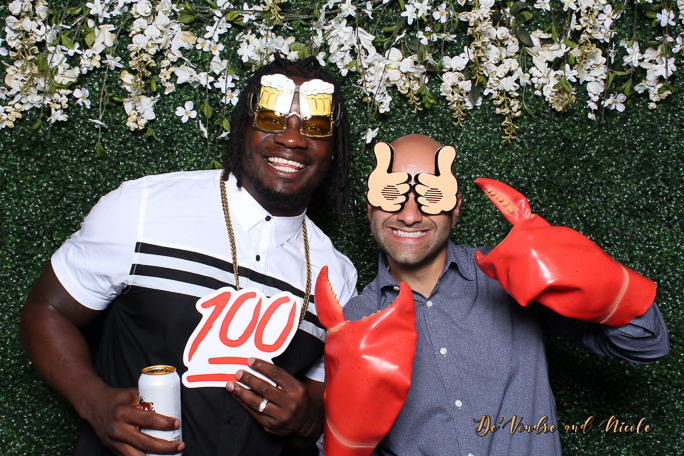 A couple posing for a phoot wearing props