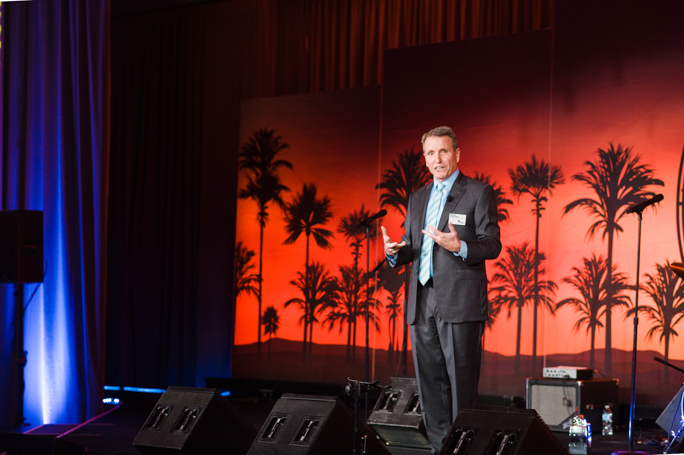 A man speaking on stage 