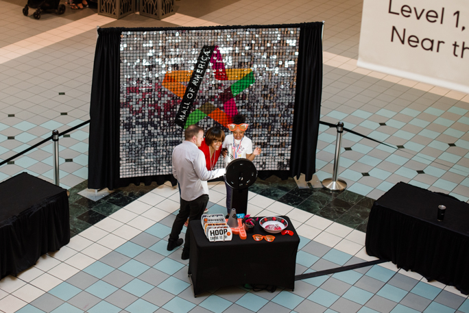 People next to a photo booth