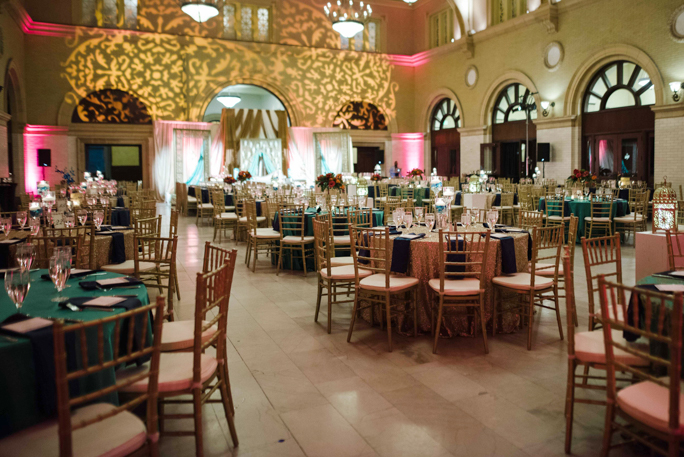 An interior of a room with tables and chairs 