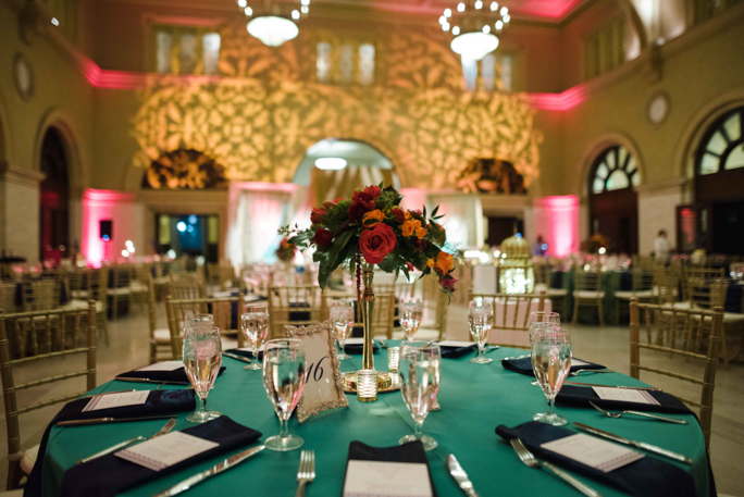 A table with flowers and glasses 