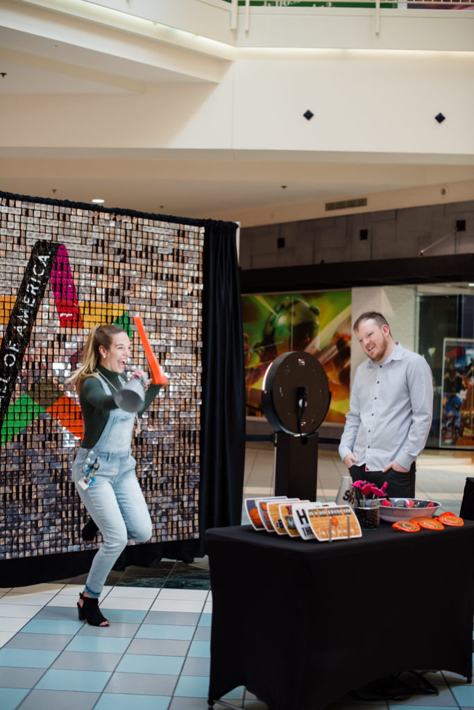 A woman posing for photos with props