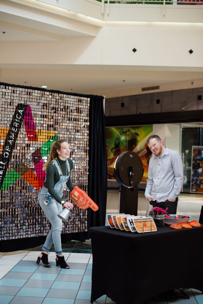 A woman posing for photos with props