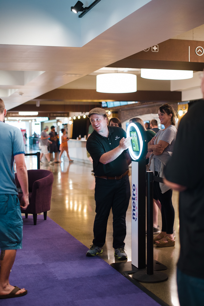 A person next to a kiosk 