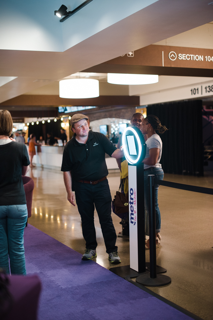 Attendant next to a kiosk 