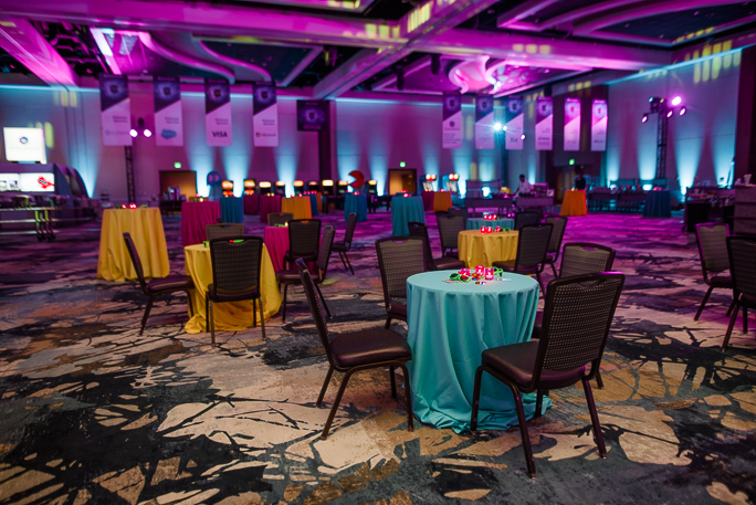 Decorated room with tables with colorful tablecloths