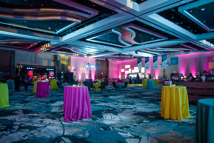 Decorated room with tables with colorful tablecloth