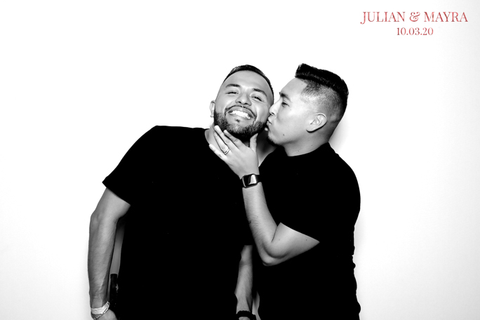 man kissing man on a cheek