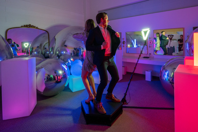 Guests stepping onto a 360 photo booth platform in Minneapolis