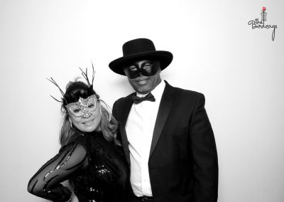 People in masks posing for a photo