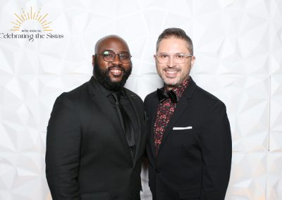 Two men smiling
