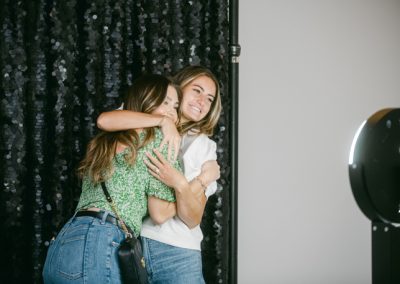 Two women smiling and hugging