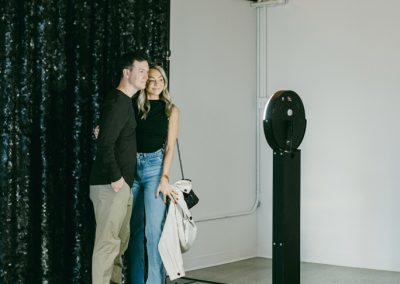 A couple using Boomerang Booth at Urban Daisy t