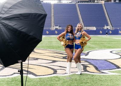 Cheerleaders posing for AI photo activation