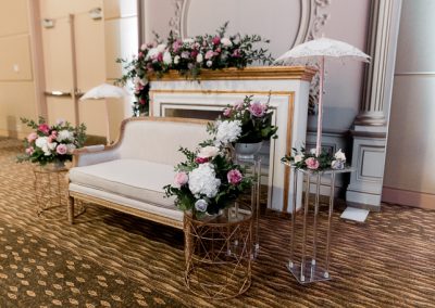 A couch with floral around