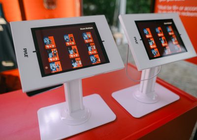 Guest using a sharing station kiosk to instantly share their event video