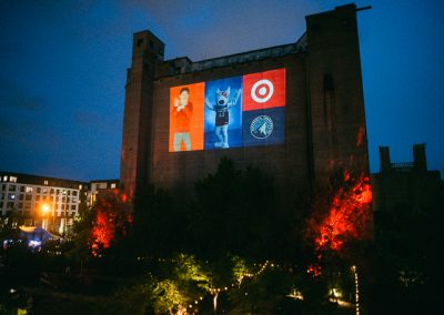 Photo booth slideshow projected on silo wall at Surely Brewery corporate event in Minneapolis