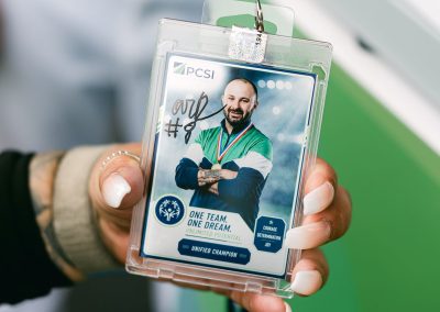 Guest holding a custom branded photo booth trading card keepsake from a corporate event