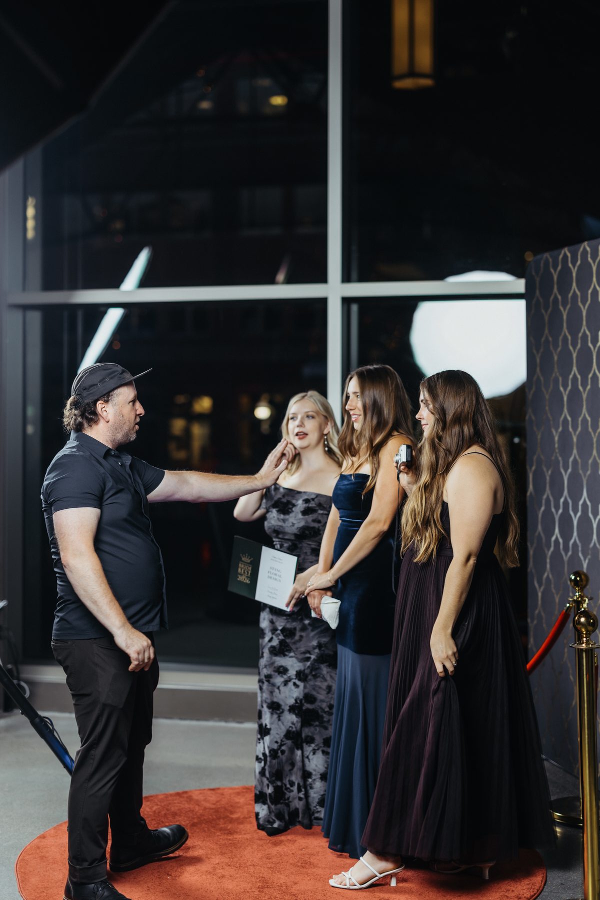 Glambot attendant directing guests on the red carpet at a Minneapolis event