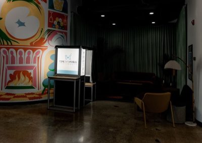Traditional enclosed photo booth rental set up in a colorful venue lounge for a teen party in Minneapolis