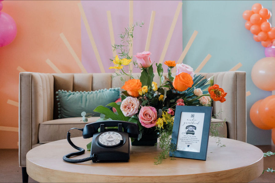 Audio guest book vintage phone on a table with flowers