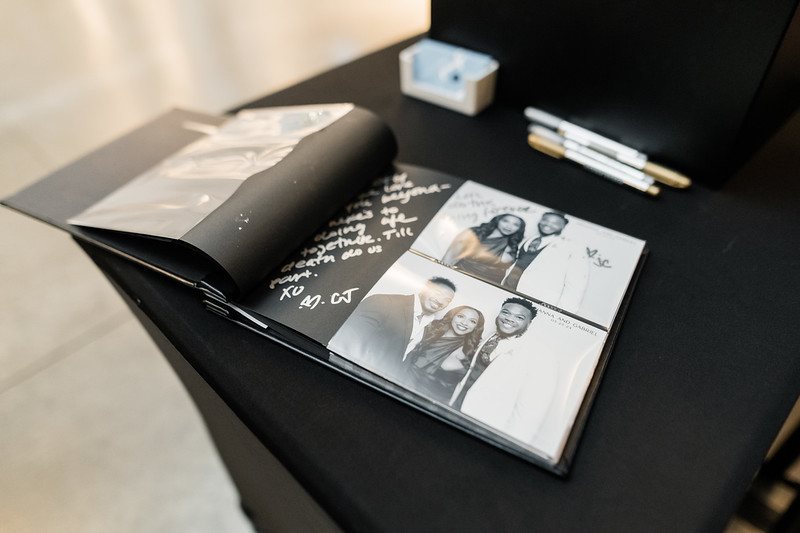 Black and white glam booth prints in a guest book album