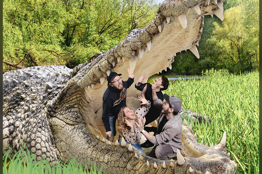 Full body green screen photo of guests inside a crocodile mouth