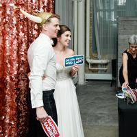 Rose gold sequin photo booth backdrop at a wedding