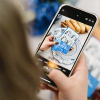 Guest sharing a photo booth strip from their phone