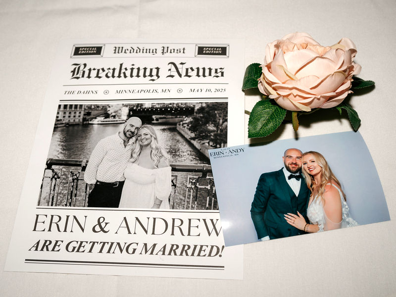Breaking News wedding sign displayed next to an open style photo booth print of the couple