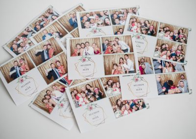 Stack of custom wedding photo booth prints with a floral monogram template from a Minneapolis wedding