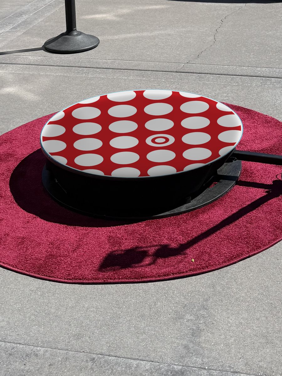 360 photo booth platform printed with a custom wrap: red and white dot pattern