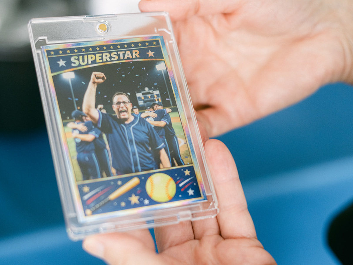 Guest holding a custom trading card printed at a photo booth brand activation