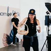 TIP attendant helping guests at a branded photo booth activation