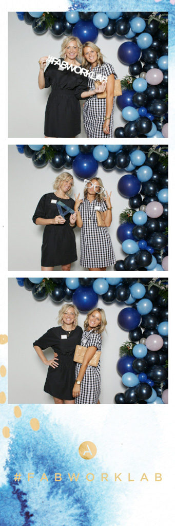 Corporate event photo strip with a blue watercolor logo and two women next to a balloon garland