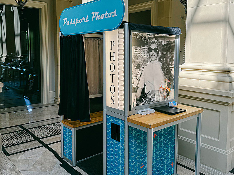 Enclosed photo booth with a full custom blue wrap