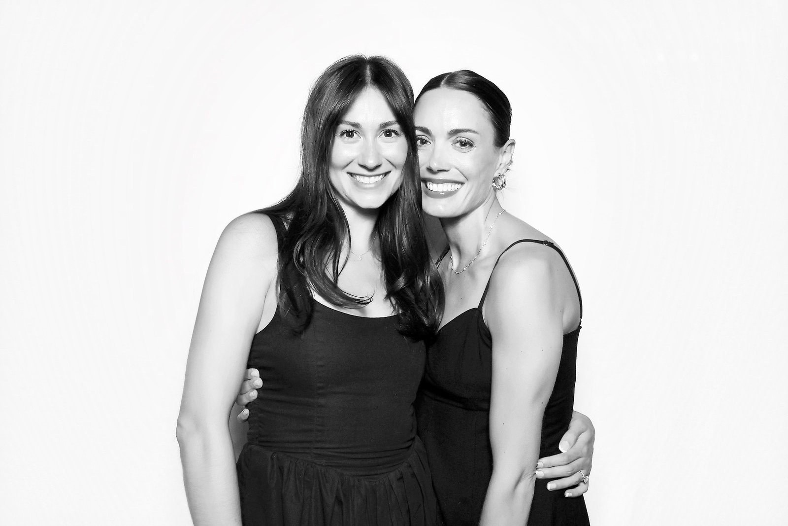 The same two friends after instant glam retouching in black and white