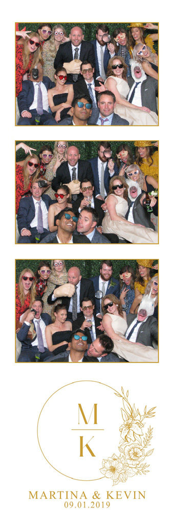 Gold monogram wedding photo strip with a big group of guests packed into the open air photo booth