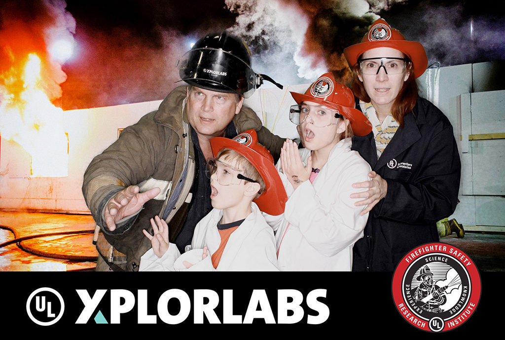 UL Xplorlabs green screen photo of a family in firefighter gear in front of a fire scene